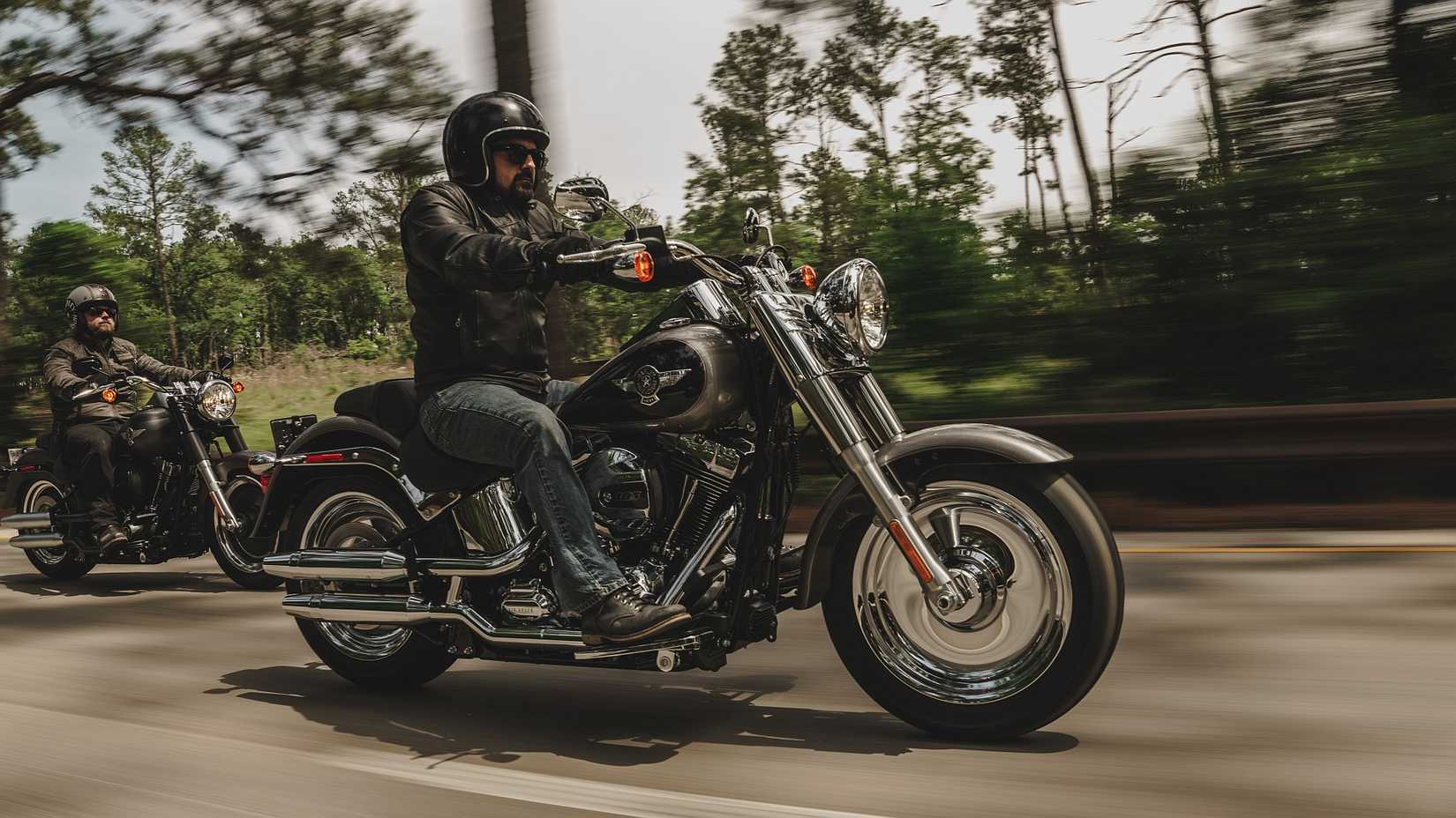 Side shot of a rider cruising on the 2017 Harley-Davidson Fat Boy