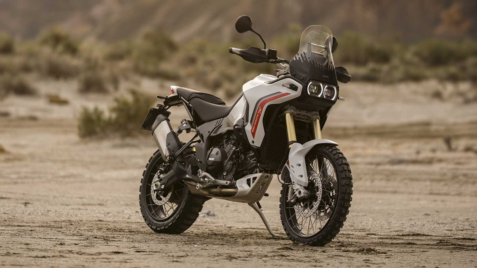 2026 Ducati DesertX V2 on an off-road course front third quarter view