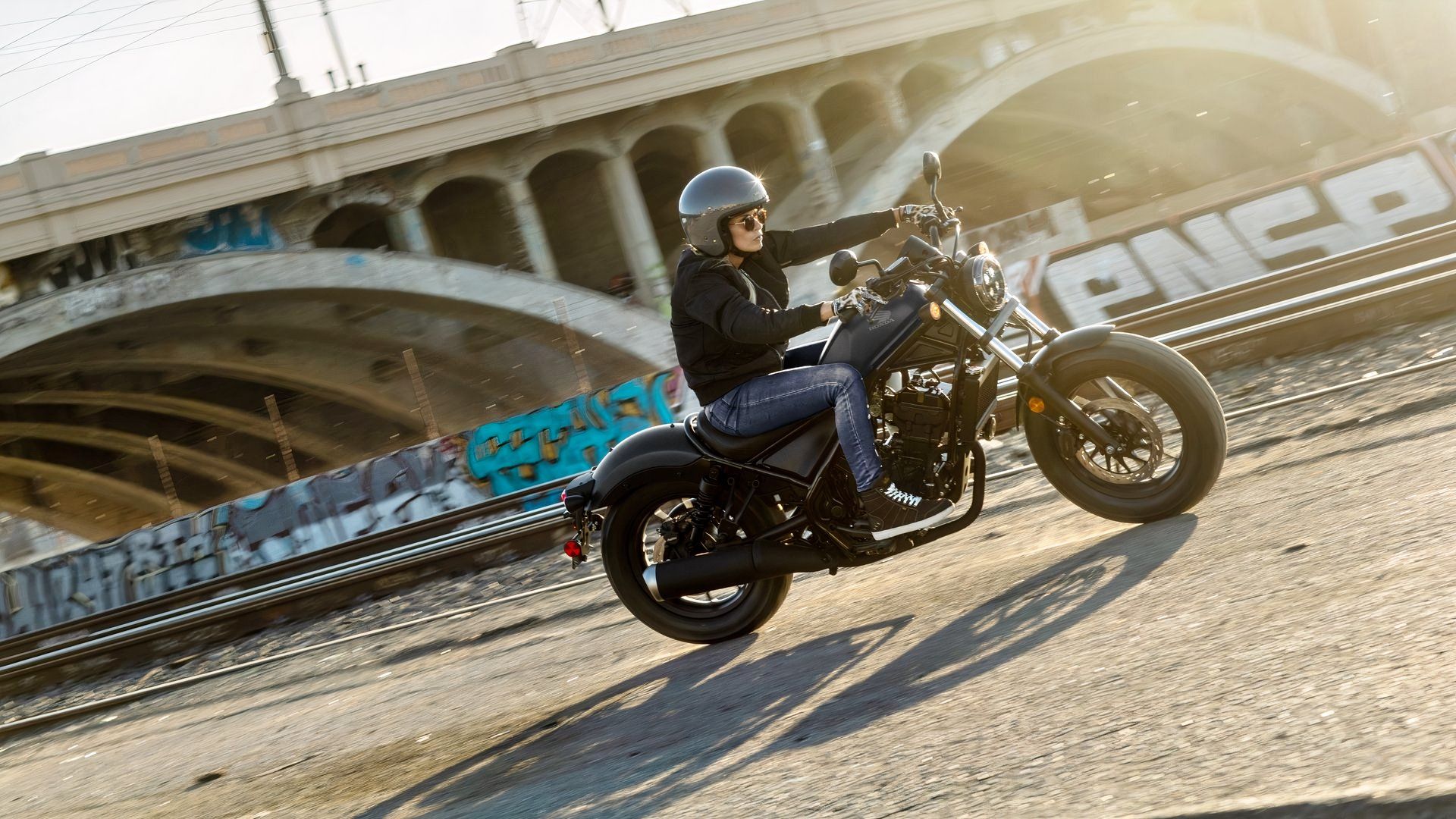 2026 Honda Rebel 300 E-Clutch action riding shot side