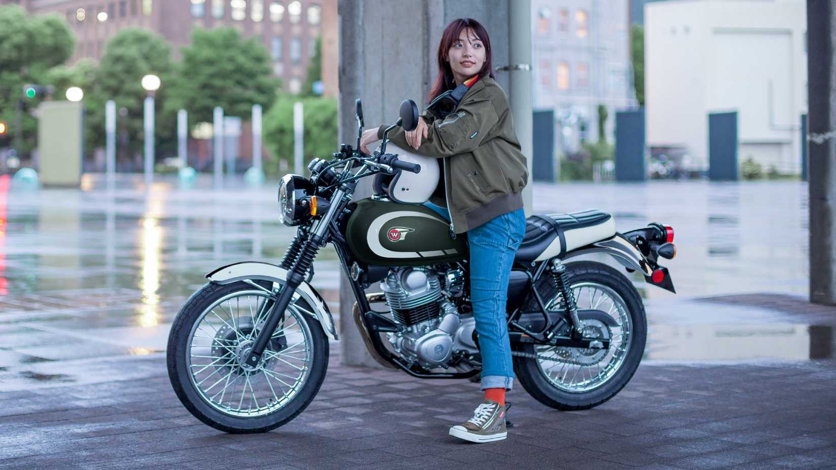 A motorcyclist posing on the 2026 Kawasaki W230