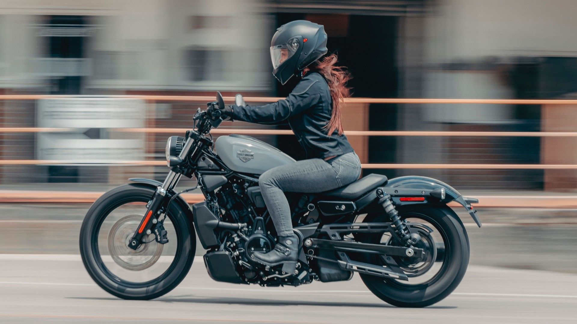 2026 Harley-Davidson Nightster on the road accelerating side profile view