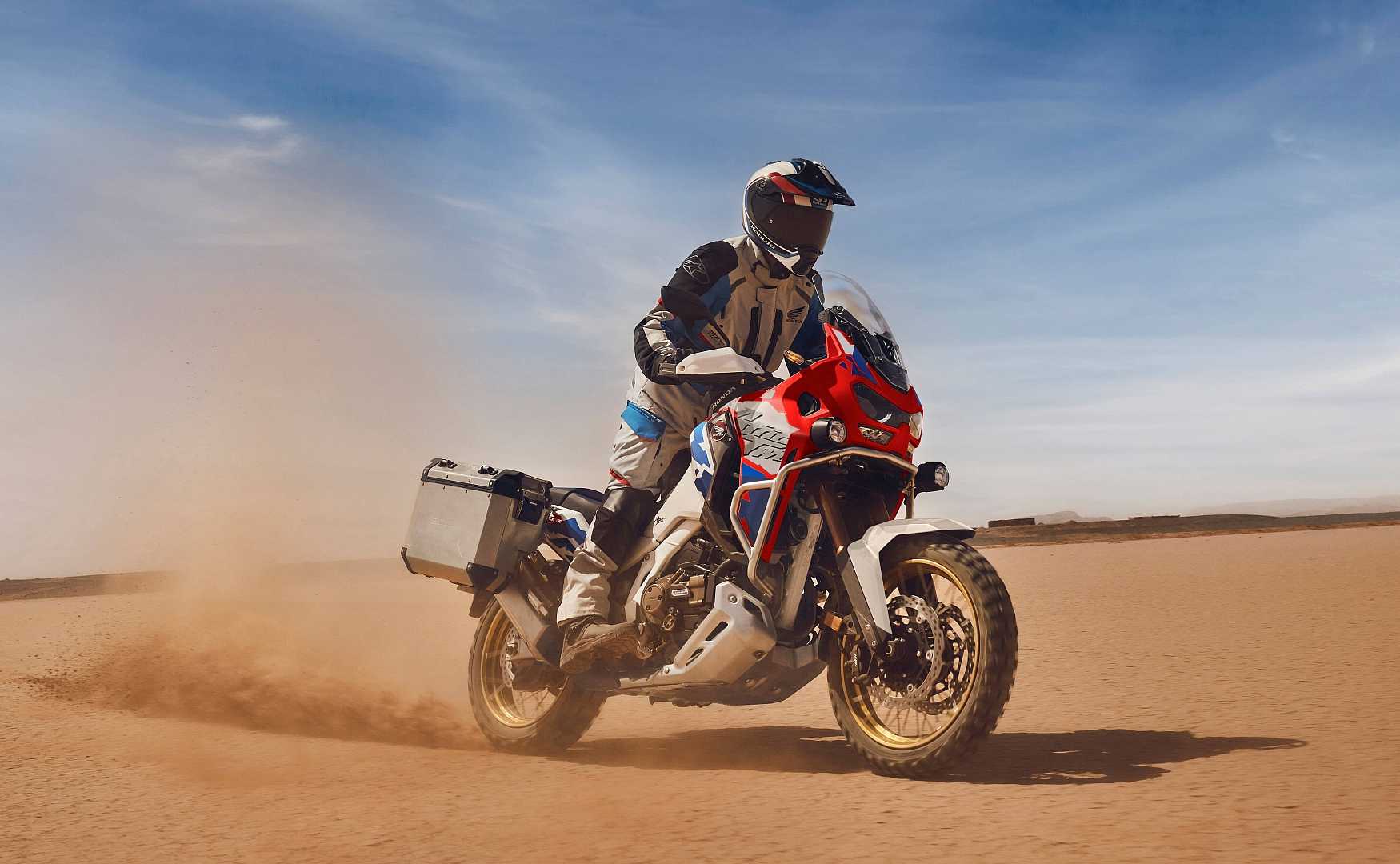 2026 Honda Africa Twin adventure sports kicking up off-road dust