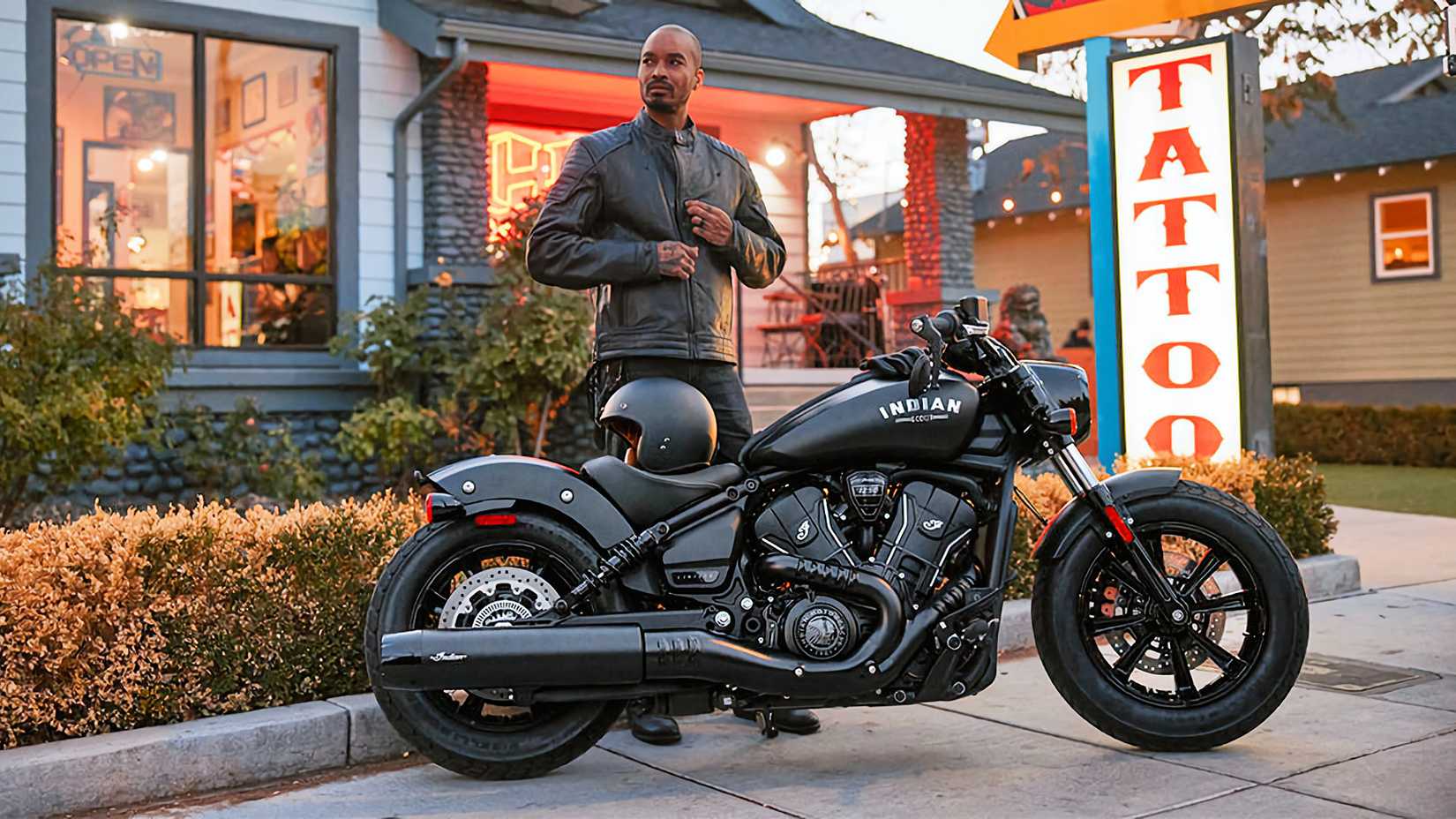 Rider standing next to a 2026 Indian Scout Bobber