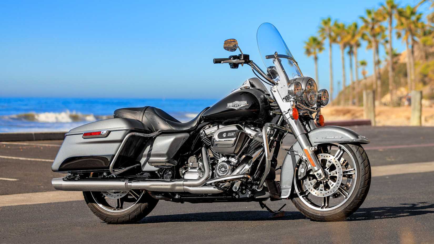 Black 2022 Harley-Davidson Road King parked seaside
