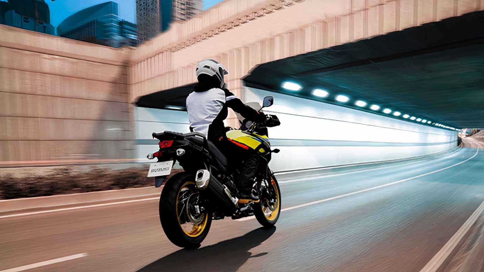 Rear shot of a 2025 Suzuki V-Strom 650 XT cruising on highway
