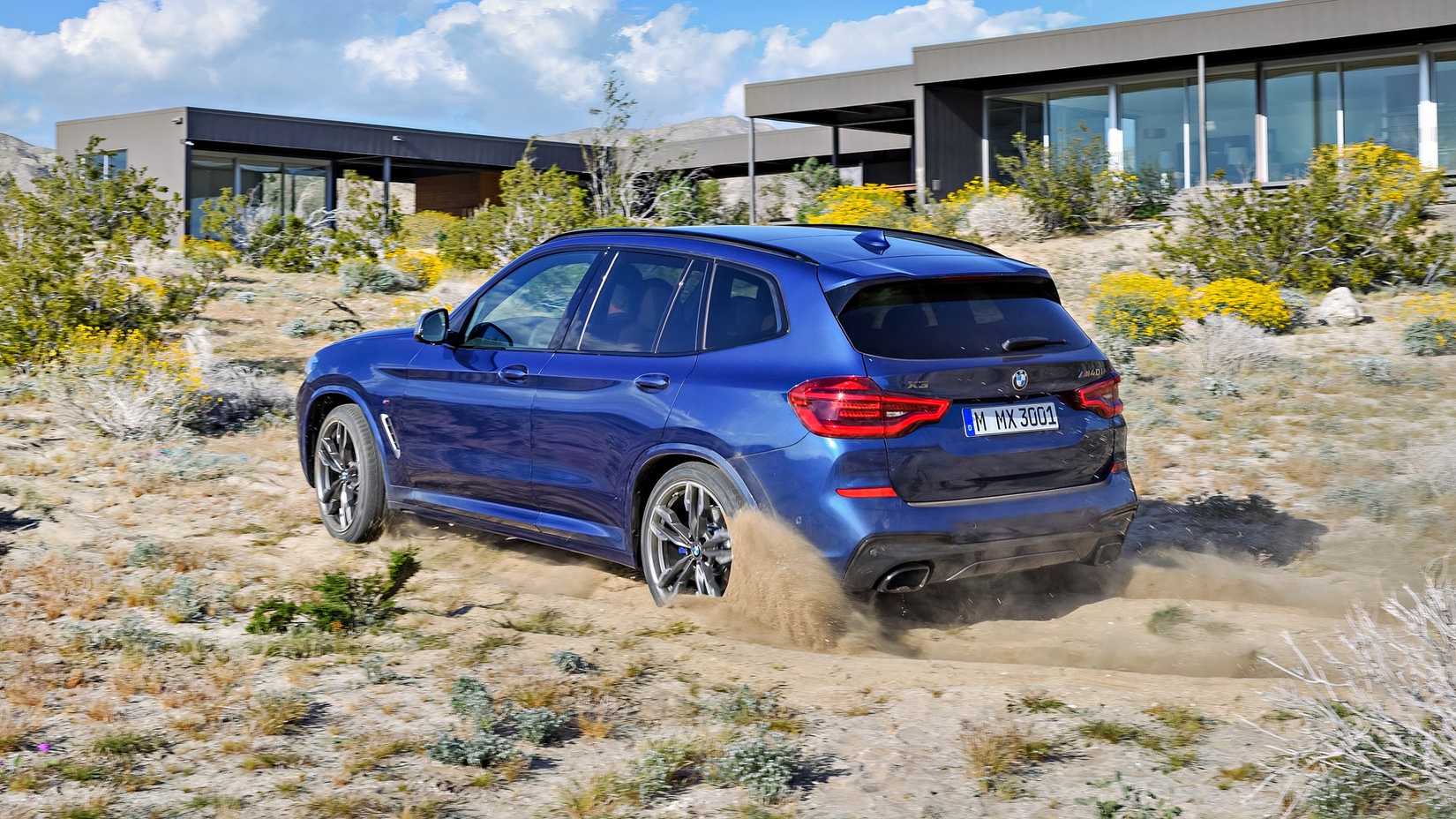 2026 BMW X3 rear 3/4 action shot