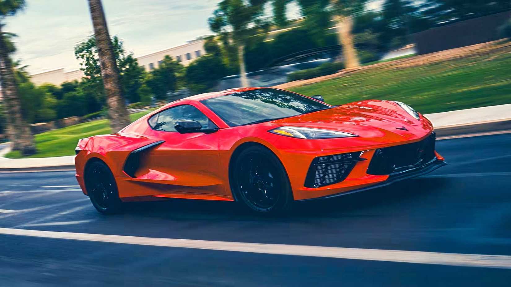 A front and side view of a 2026 Chevrolet Corvette Stingray driving