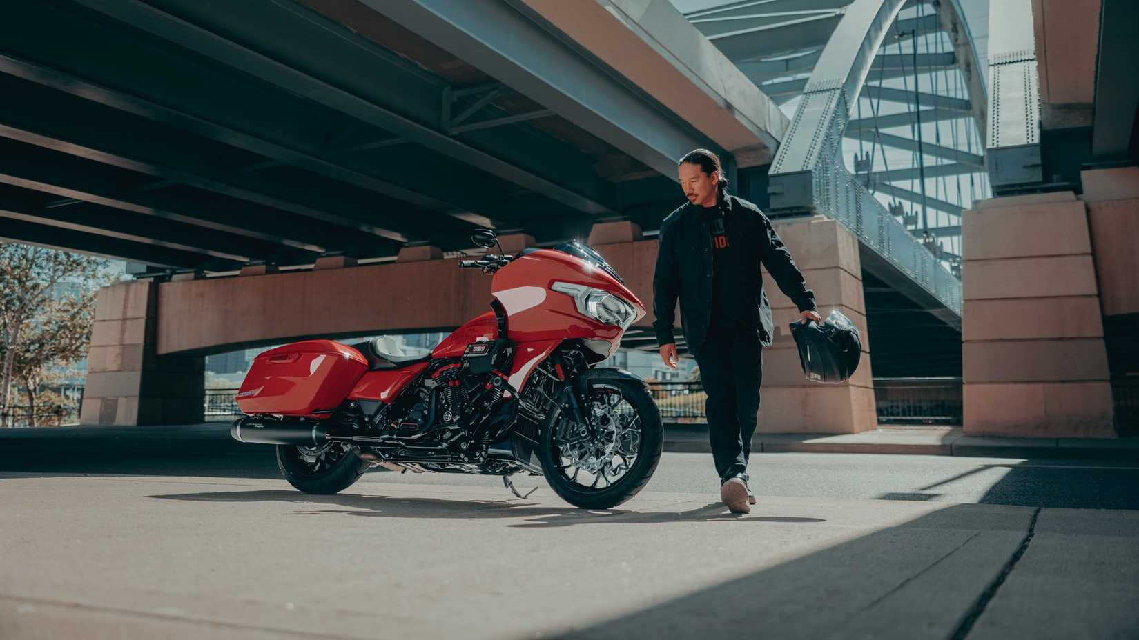 A rider walking away from the 2026 Harley-Davidson CVO Road Glide ST