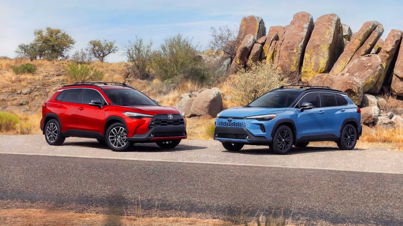 2026 Toyota Corolla Cross blue hybrid model and red regular model posed together