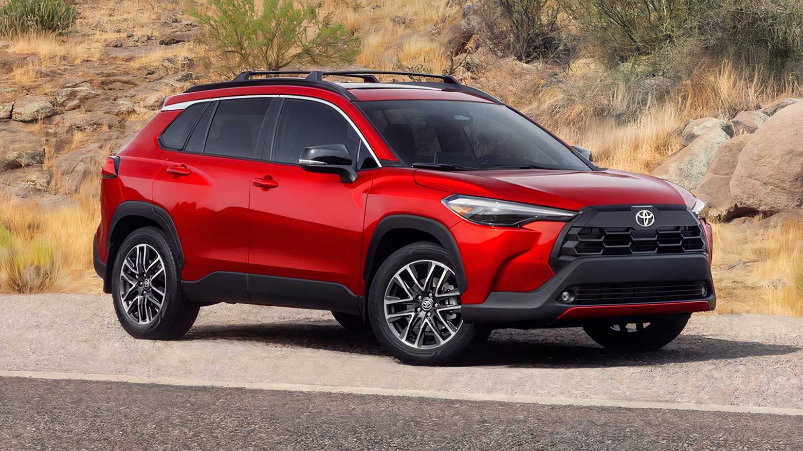 Front 3/4 shot of a red 2026 Toyota Corolla Cross parked on the road