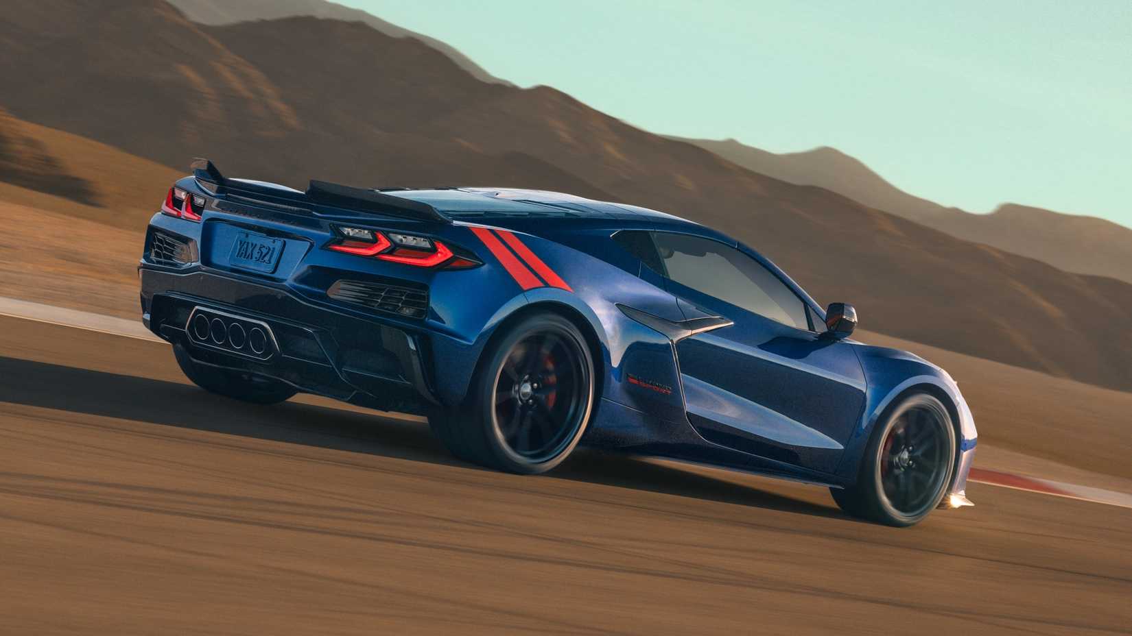 2027 Chevrolet Corvette Grand Sport in Admiral Blue Metallic accelerating on track