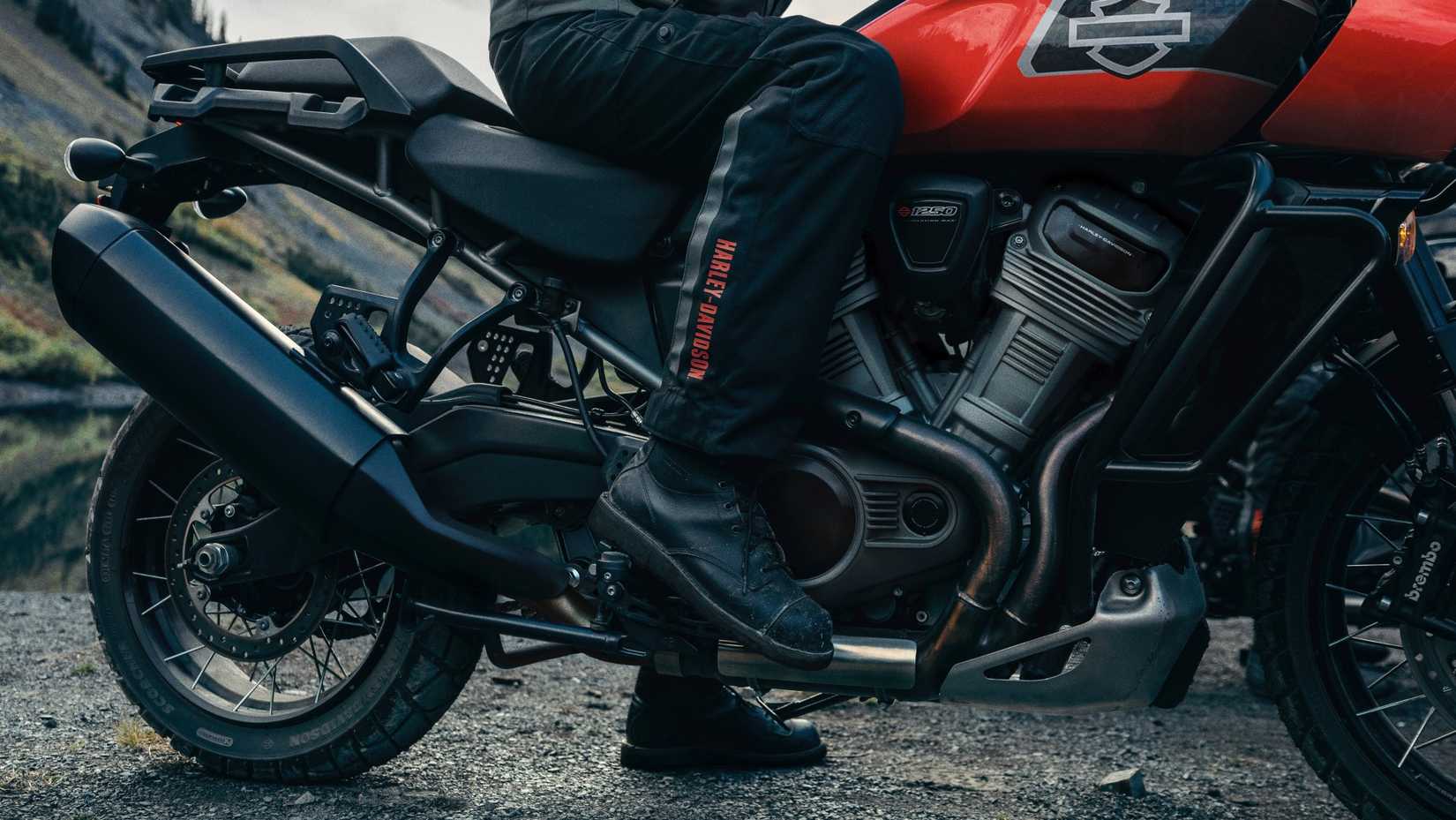 2026 Harley-Davidson Pan America 1250 Special in orange static on an off-road course