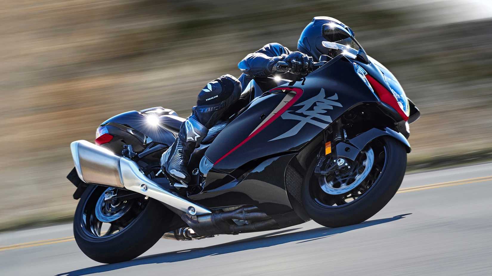 2026 Suzuki Hayabusa curvando vista de perfil lateral difícil