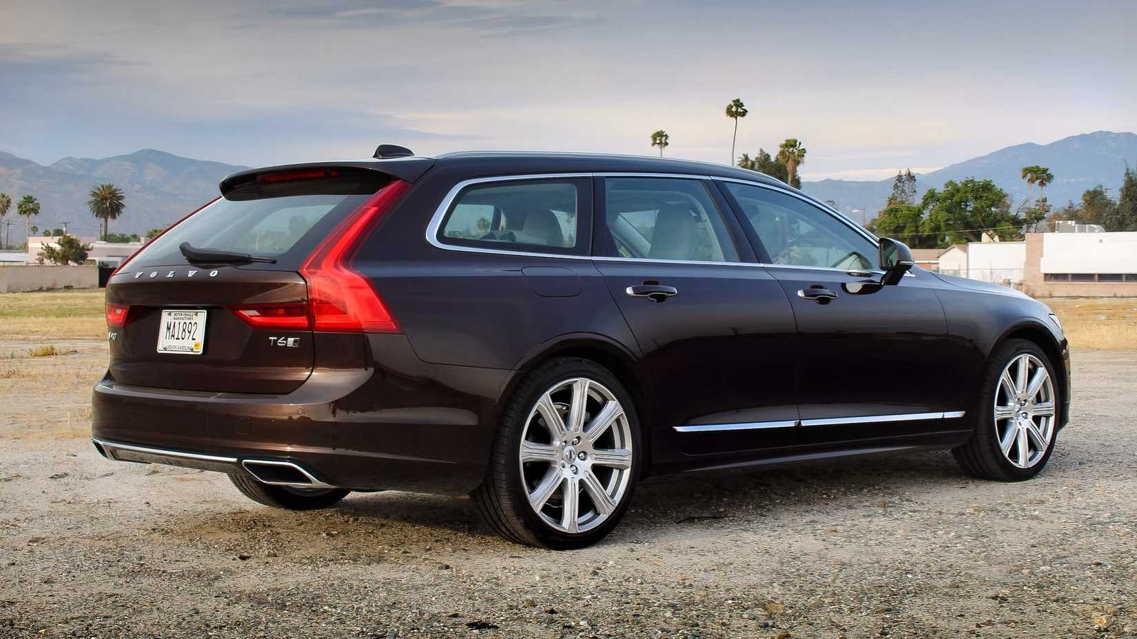 Rear 3/4 shot of a black 2020 Volvo V90 parked off-road