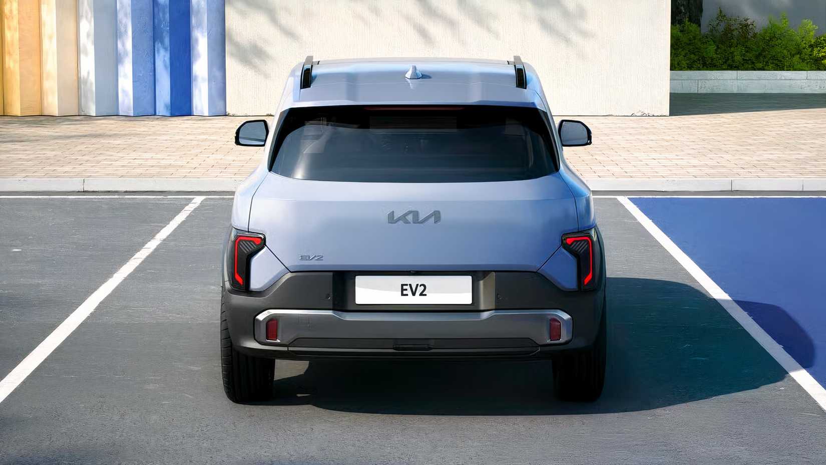 2027 Kia EV2 rear shot parked in front of building