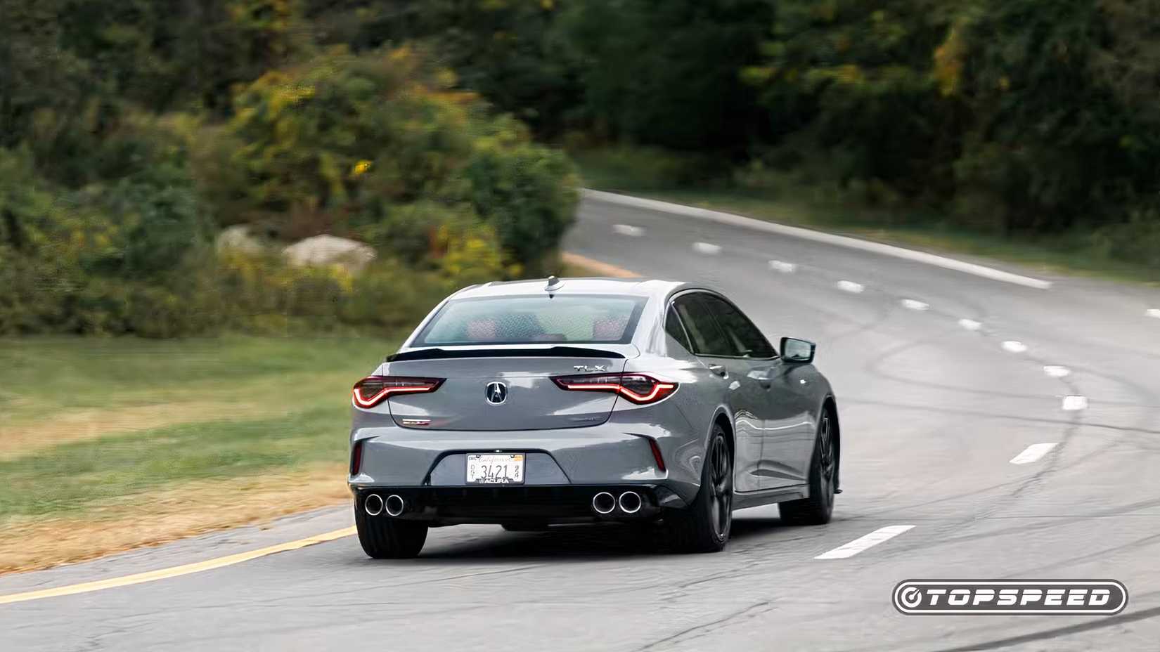 Rear shot of a 2024 Acura TLX Type S driving off