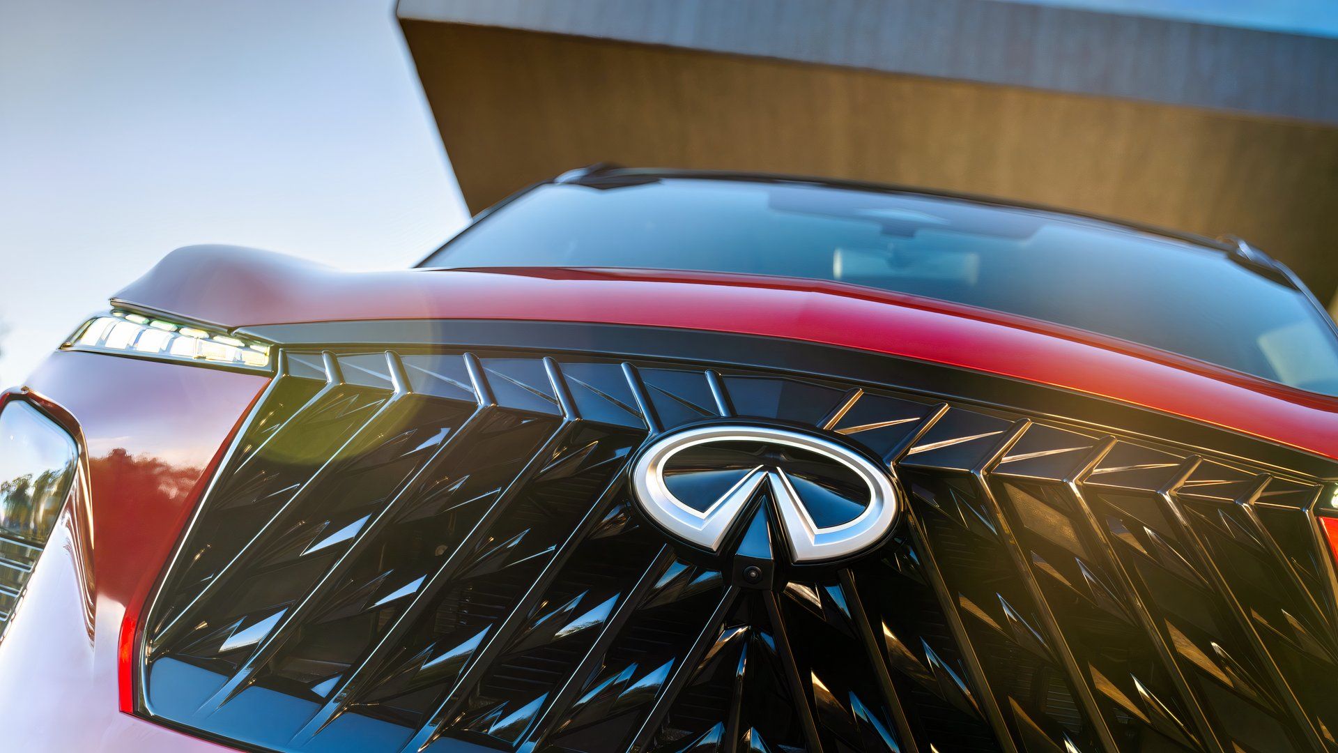 Front close-up shot of a 2027 Infiniti QX65's grille