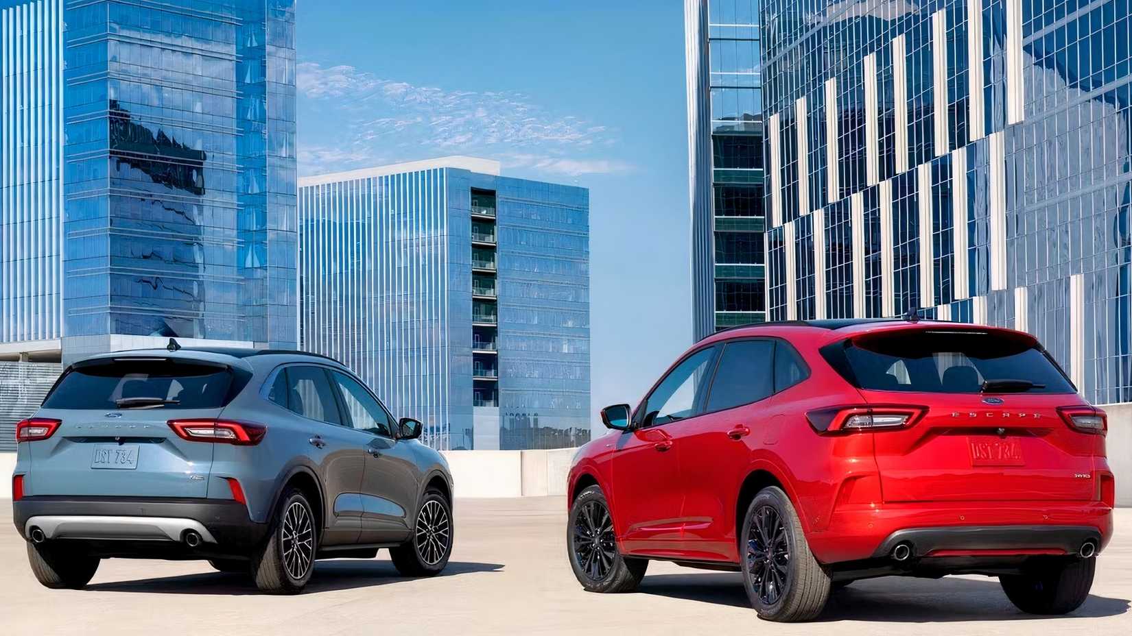 2026 Ford Escape rear shot of two models in front of buildings