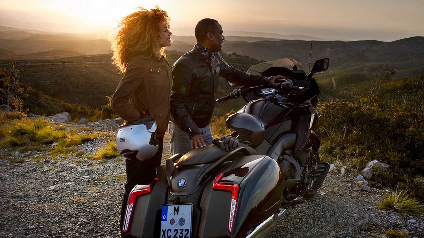 BMW K 1600 B loaded for touring duties with two riders standing