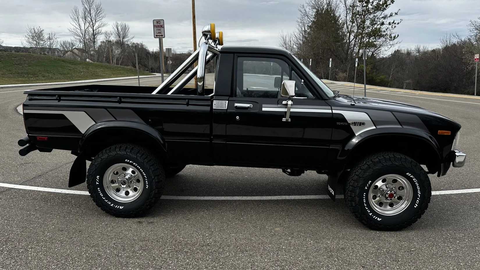 The side profile view of a black 1981 Toyota Pickup SR-5 4×4 5-Speed