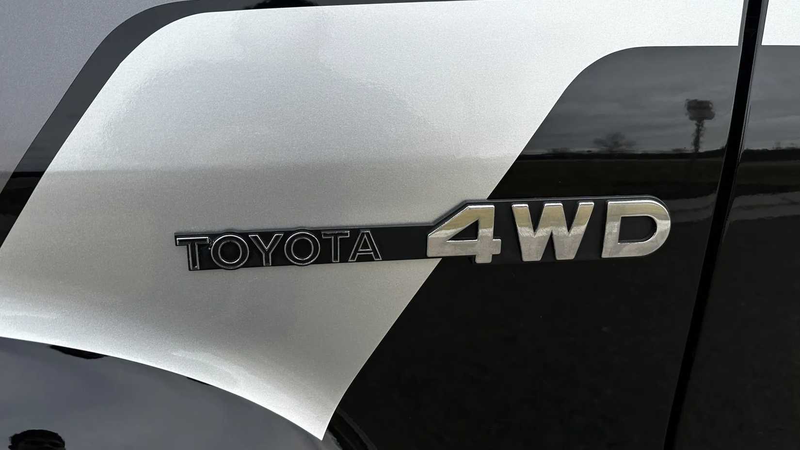The 4WD badge of a black 1981 Toyota Pickup SR-5 4×4 5-Speed