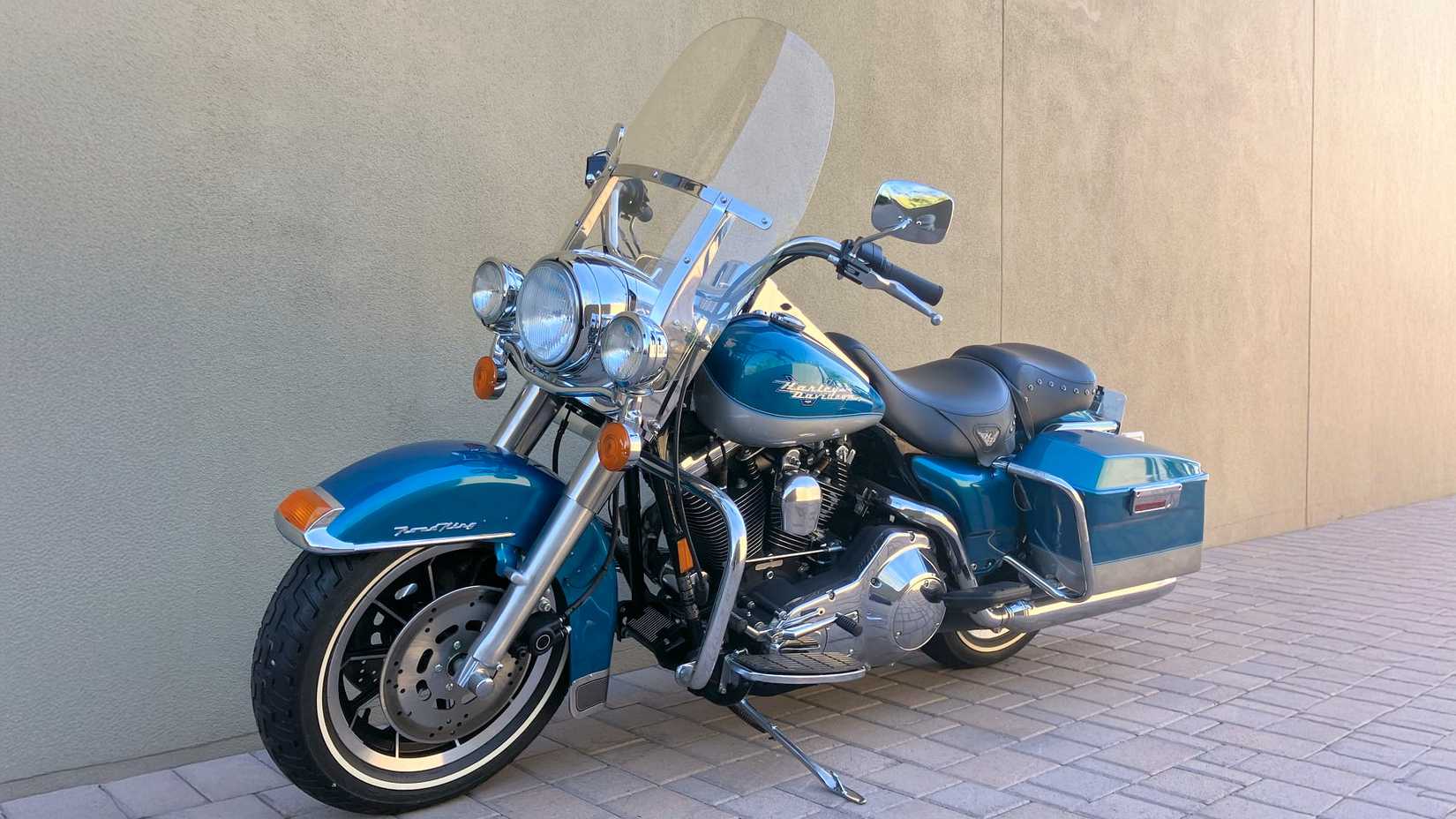 1994 Harley-Davidson Road King static front quarter shot parked along a wall