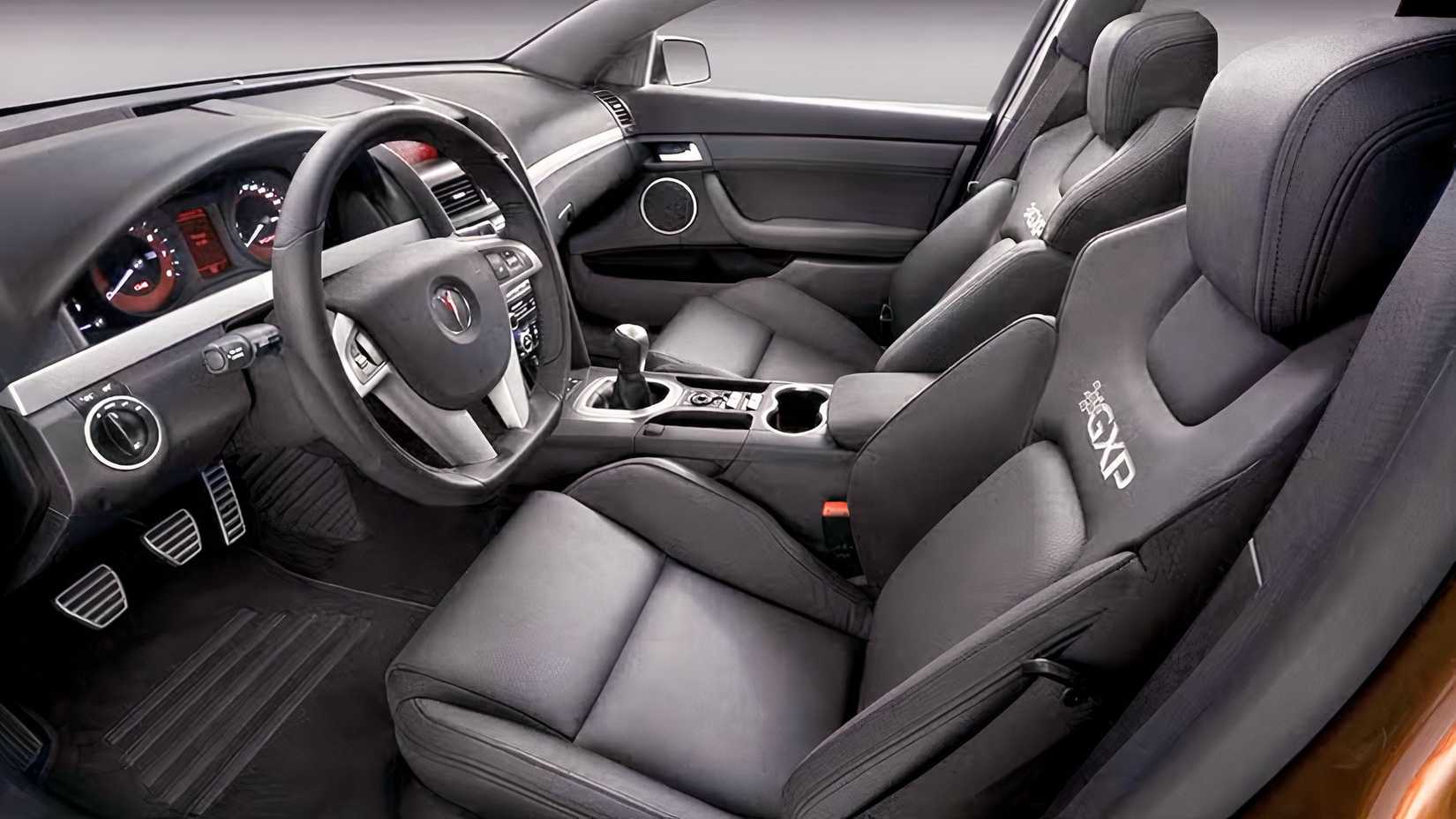Foto do interior do Pontiac G8 GXP 2009 mostrando os bancos dianteiros