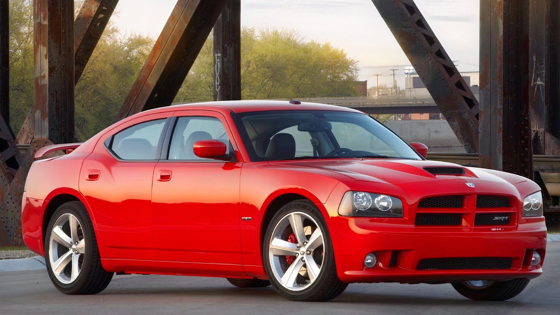 Red 2010 Dodge Charger SRT8 Posed On A Bridge