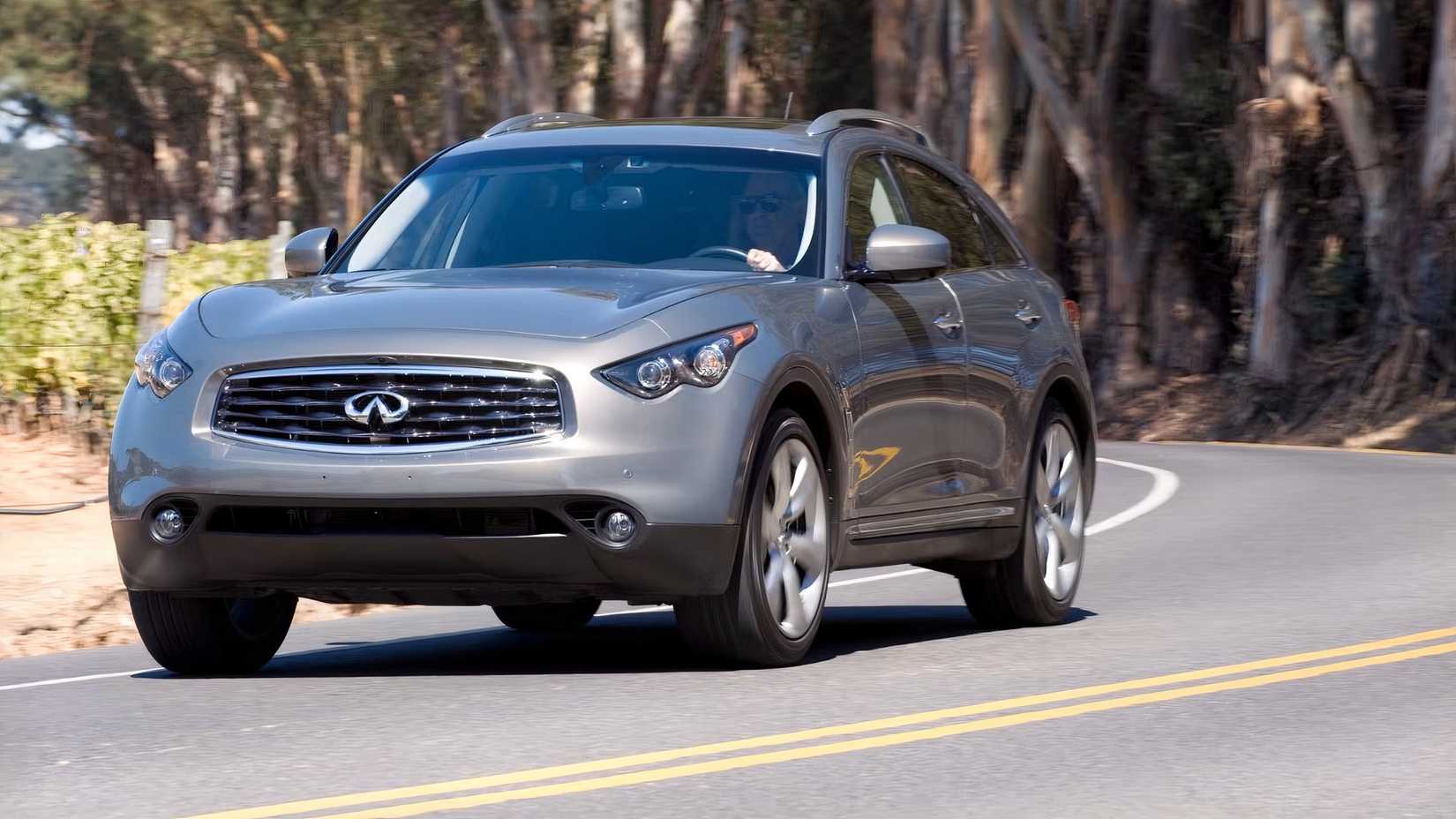Front shot of a 2012 Infiniti FX50 driving on winding road