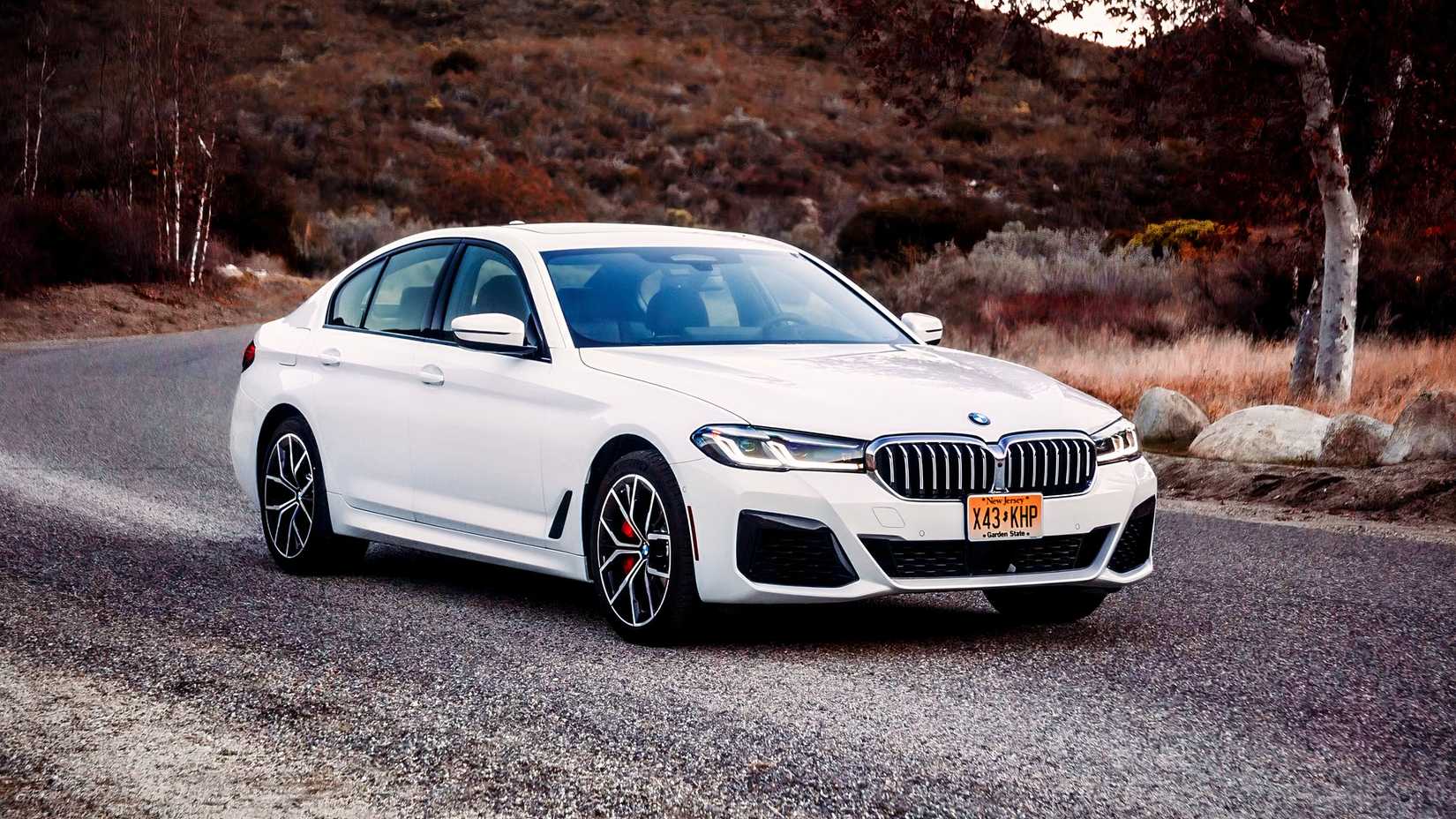 2021 BMW 5 Series Front 3/4 shot parked on the road