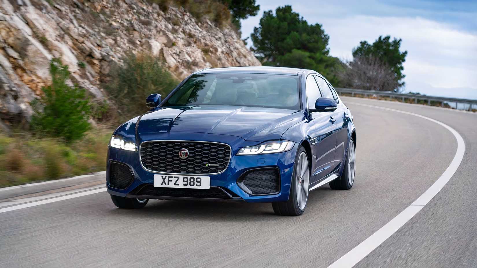 2021 Jaguar XF Front 3/4 driving down winding highway