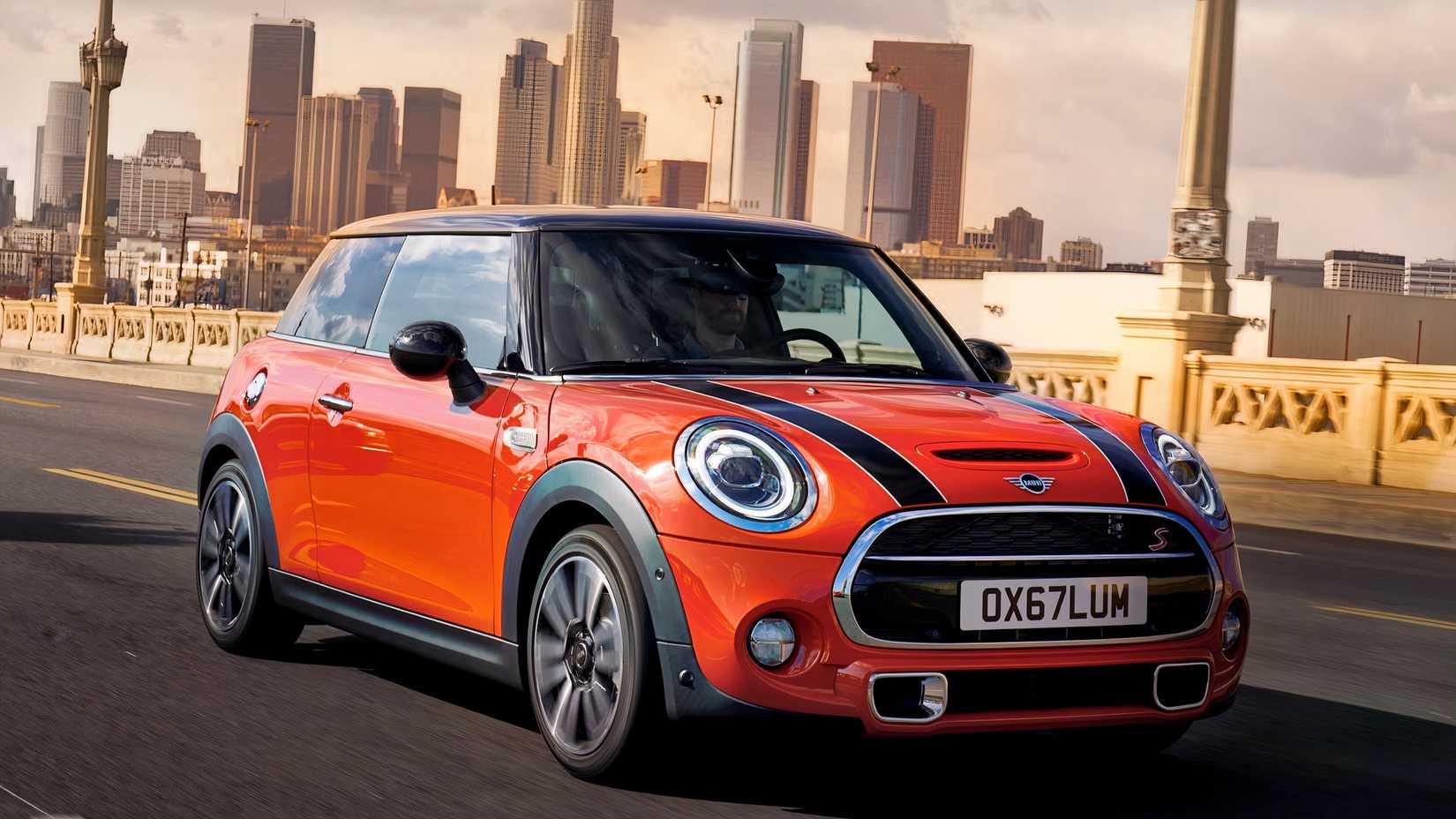 2021 Mini Cooper Front 3/4 shot driving over a bridge