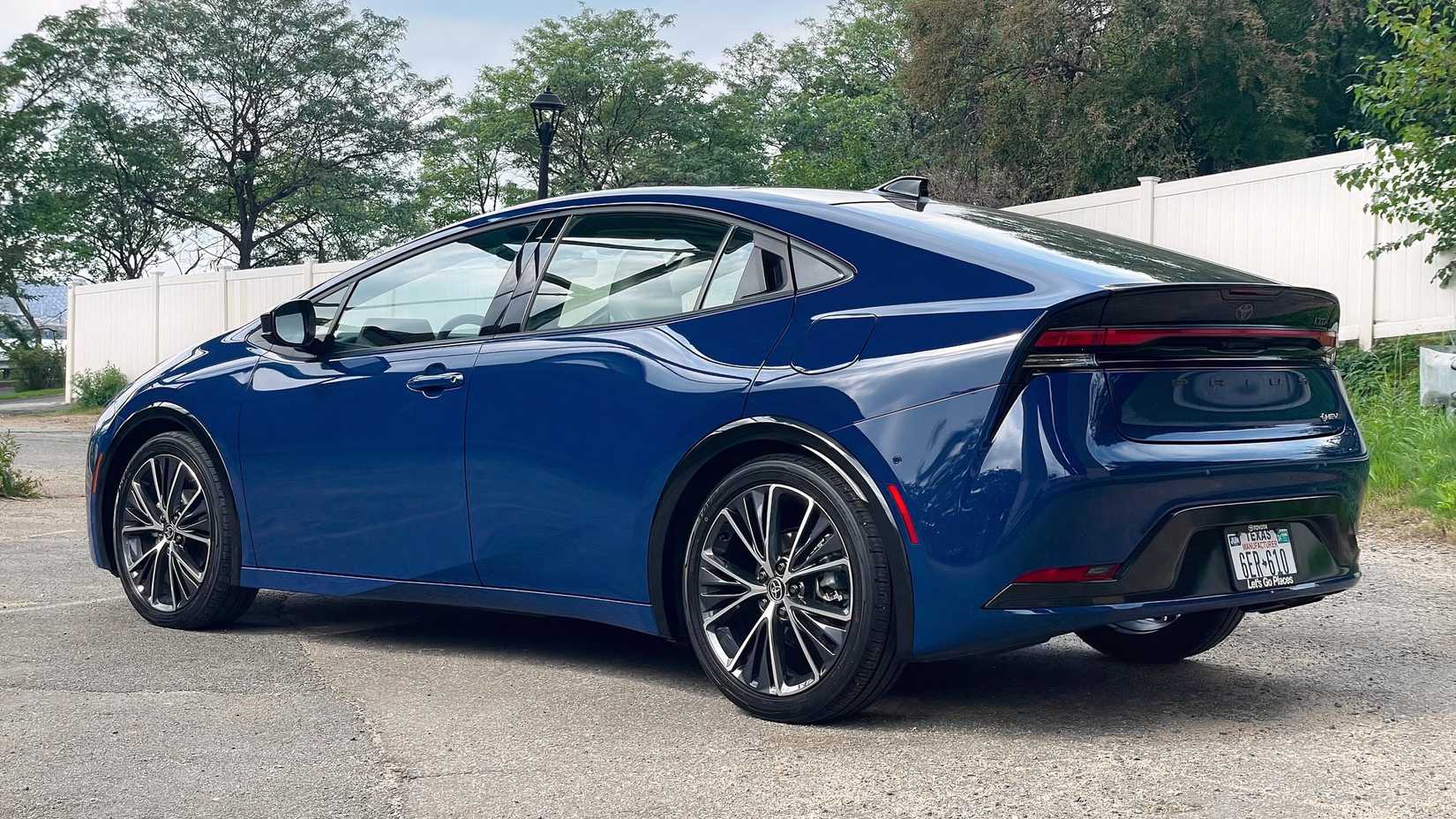 Rear 3/4 shot of a 2023 Toyota Prius parked in lot