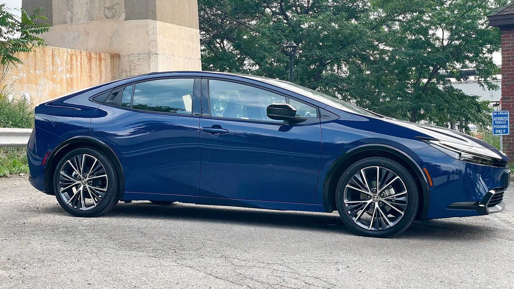 Side shot of a blue 2023 Toyota Prius parked in lot