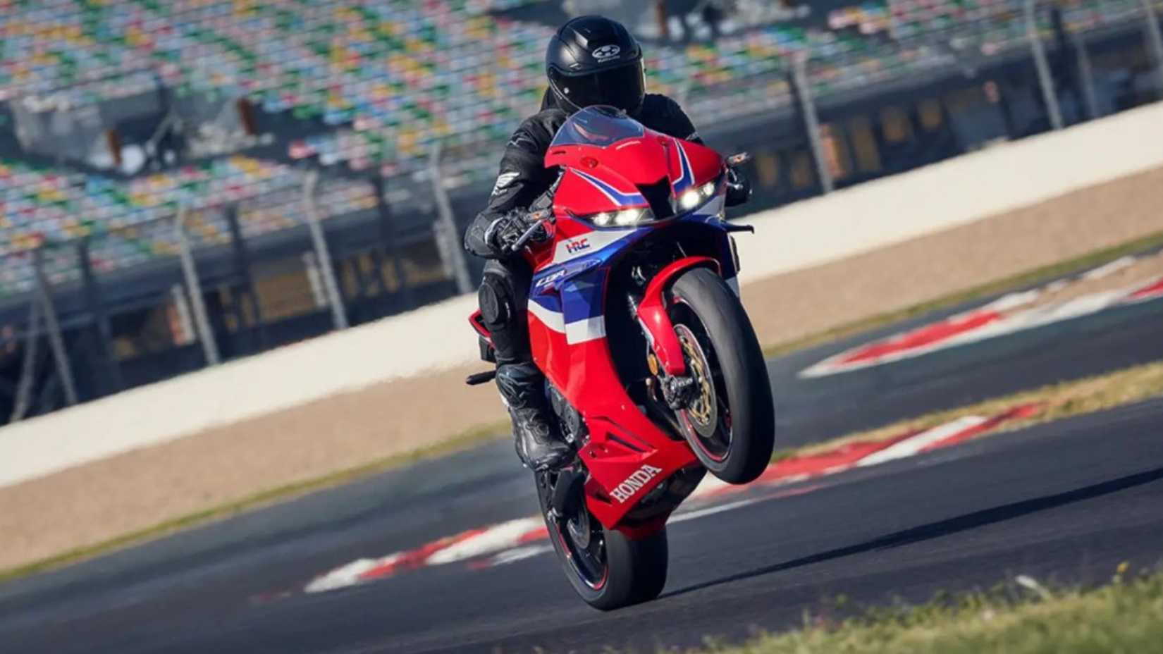 Rider popping a wheelie on a 2024 Honda CBR600RR
