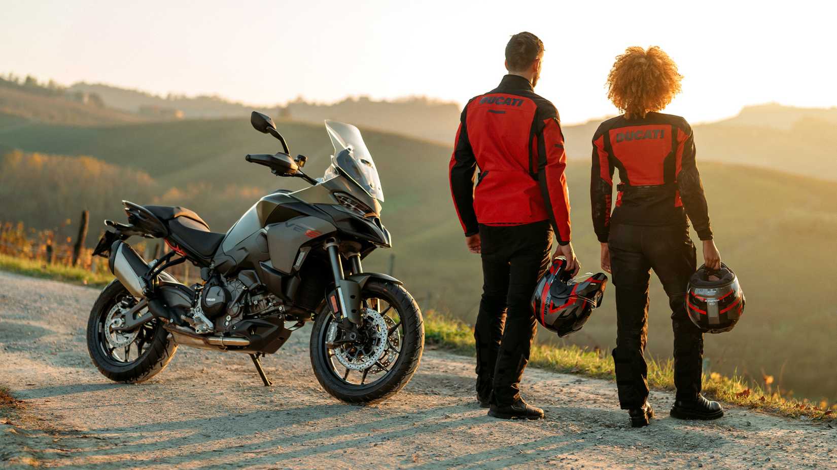 A couple standing next to the 2026 Ducati Multistrada V2 S
