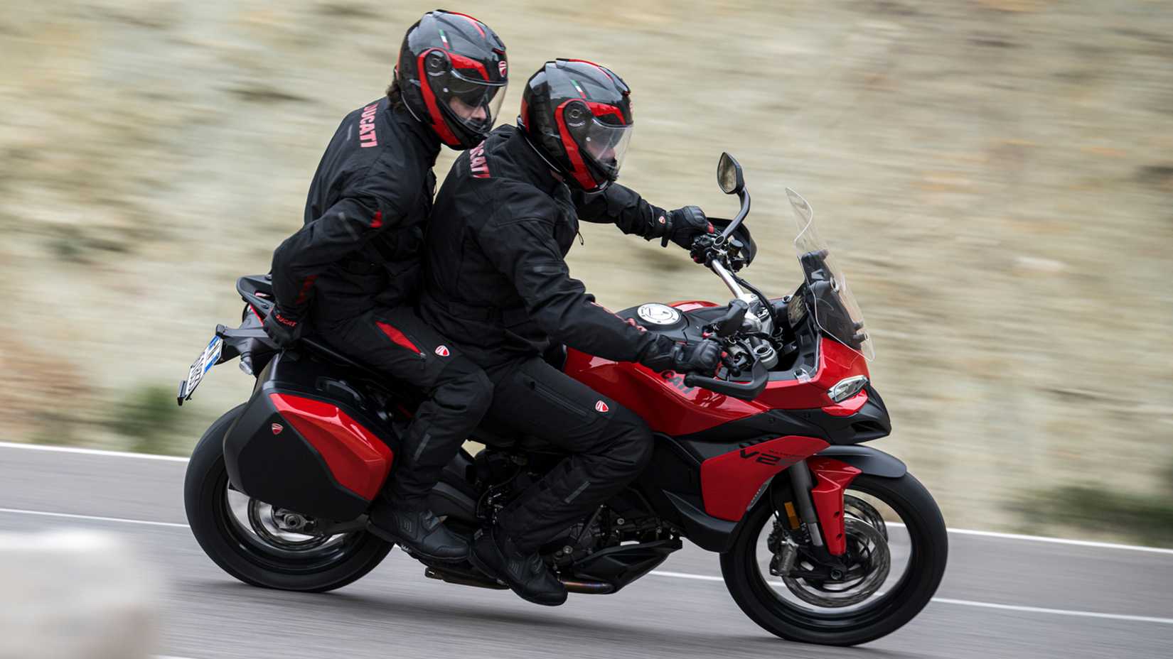 A couple cornering on the 2026 Ducati Multistrada V2 S