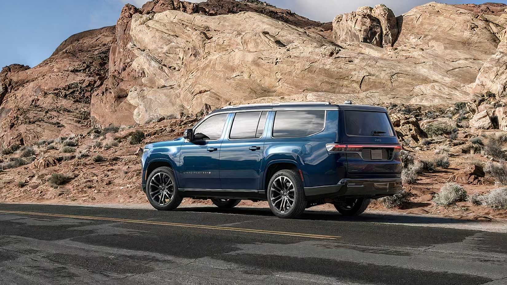 Rear 3/4 shot of a 2026 Grand Wagoneer parked on the side of the road