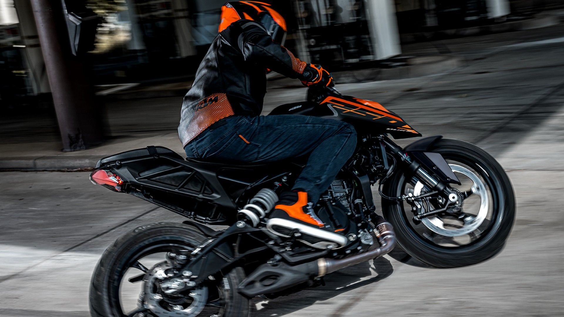 2026 KTM 250 Duke Sliding In A Parking Lot