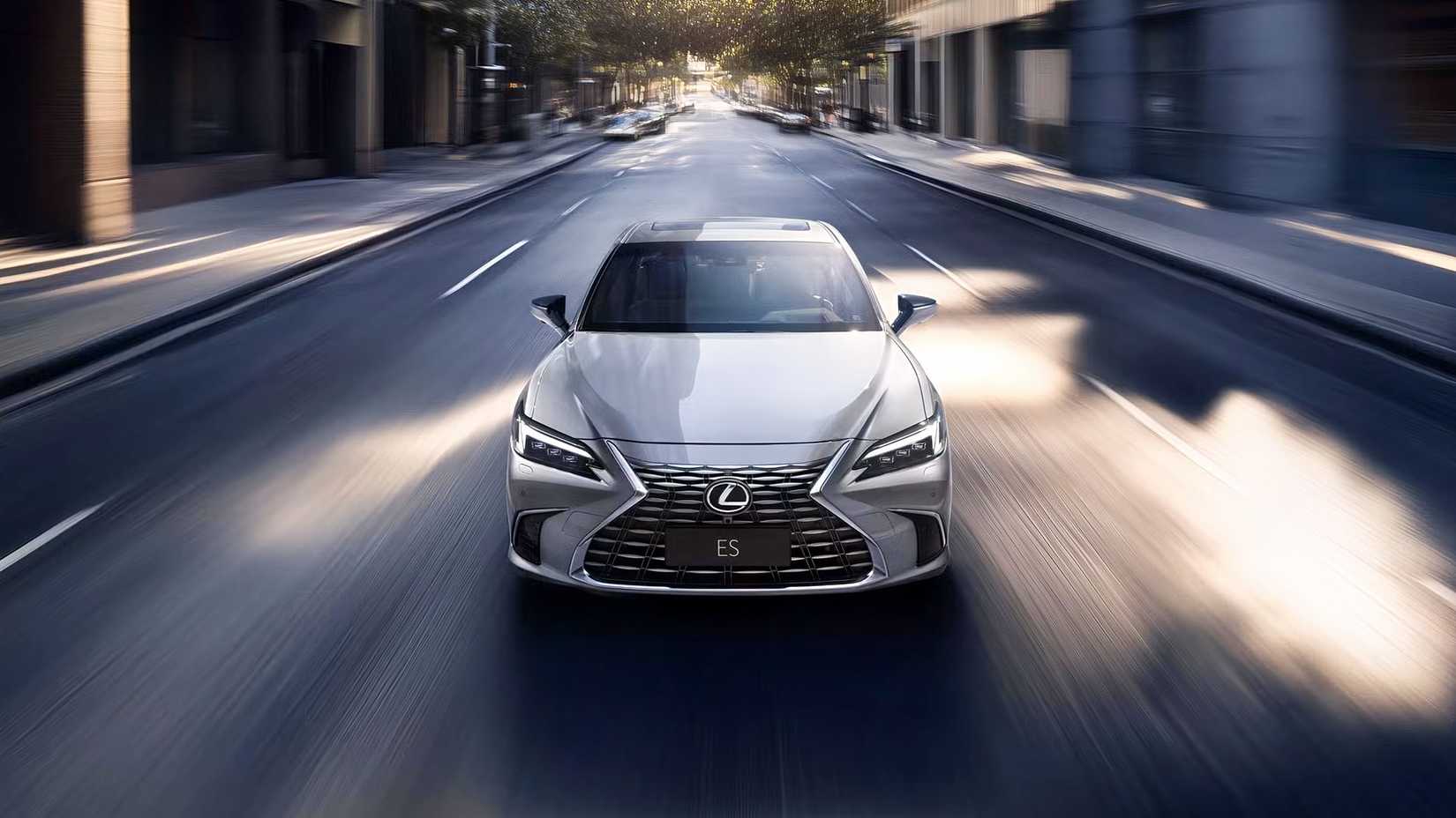 Front Head-On View Of A Silver 2025 Lexus ES 300h Driving