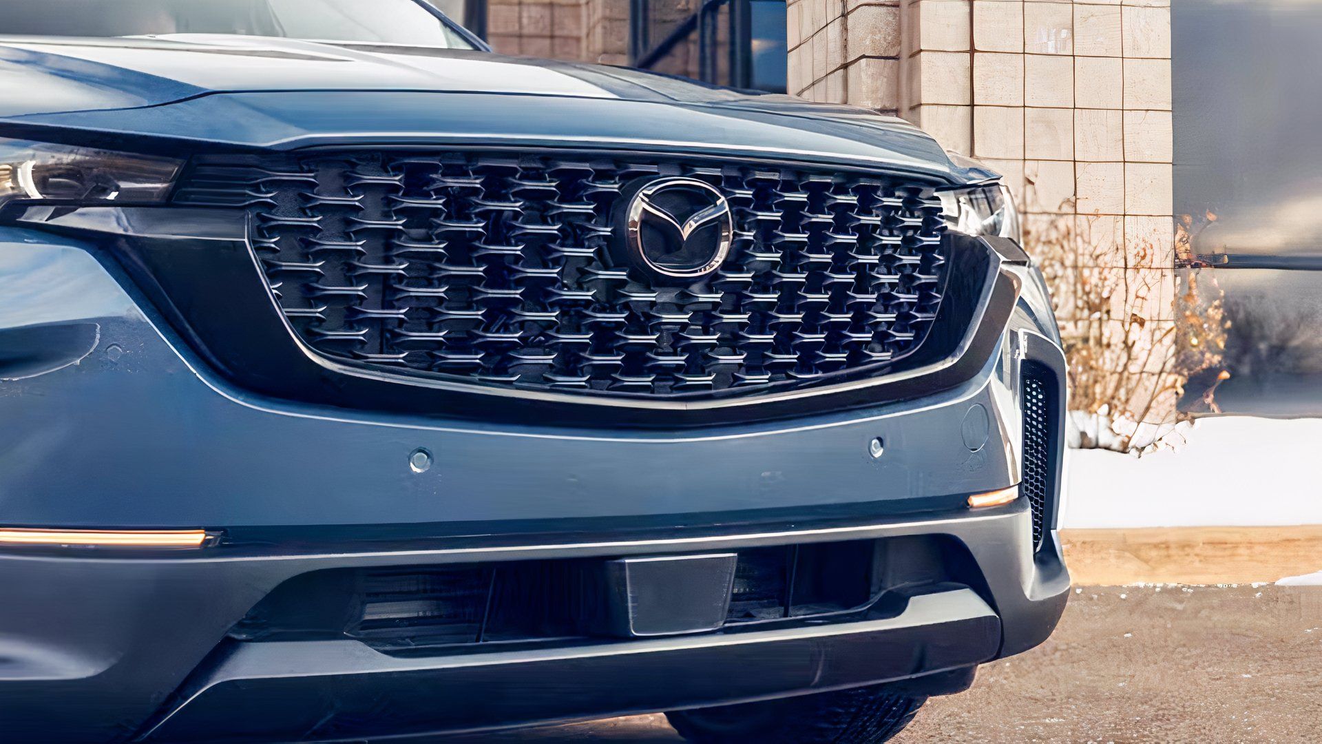 Close-up shot of a 2026 Mazda CX-50's grille