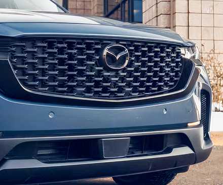 Close-up shot of a 2026 Mazda CX-50's grille
