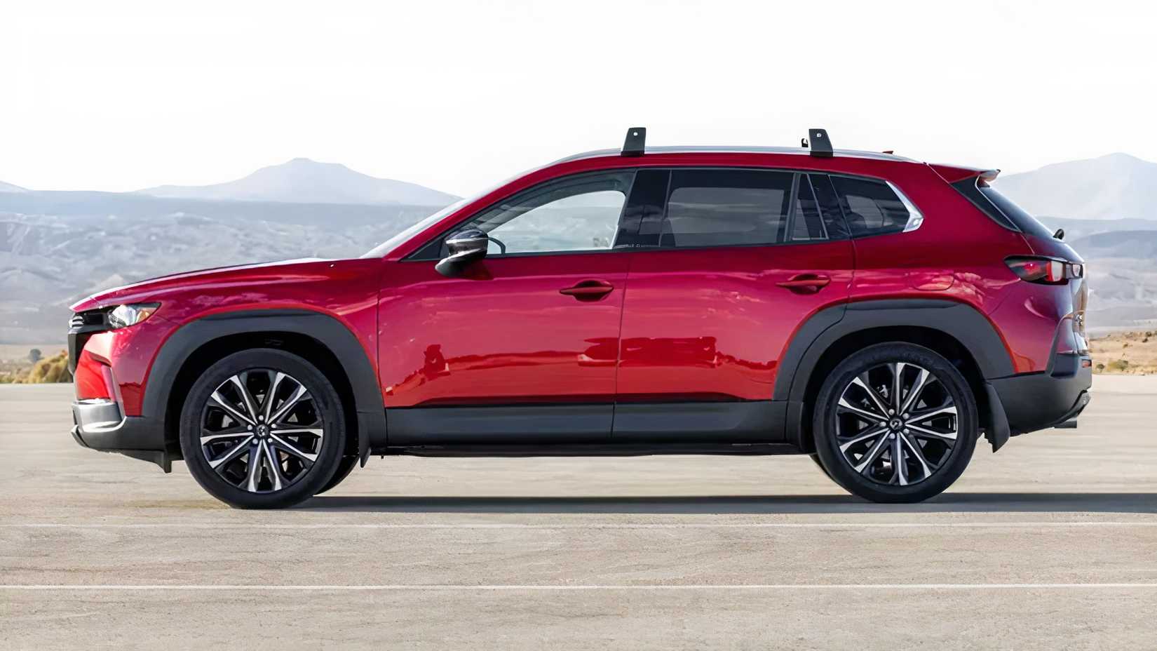 side shot of a red 2026 Mazda CX-50 parked in lot