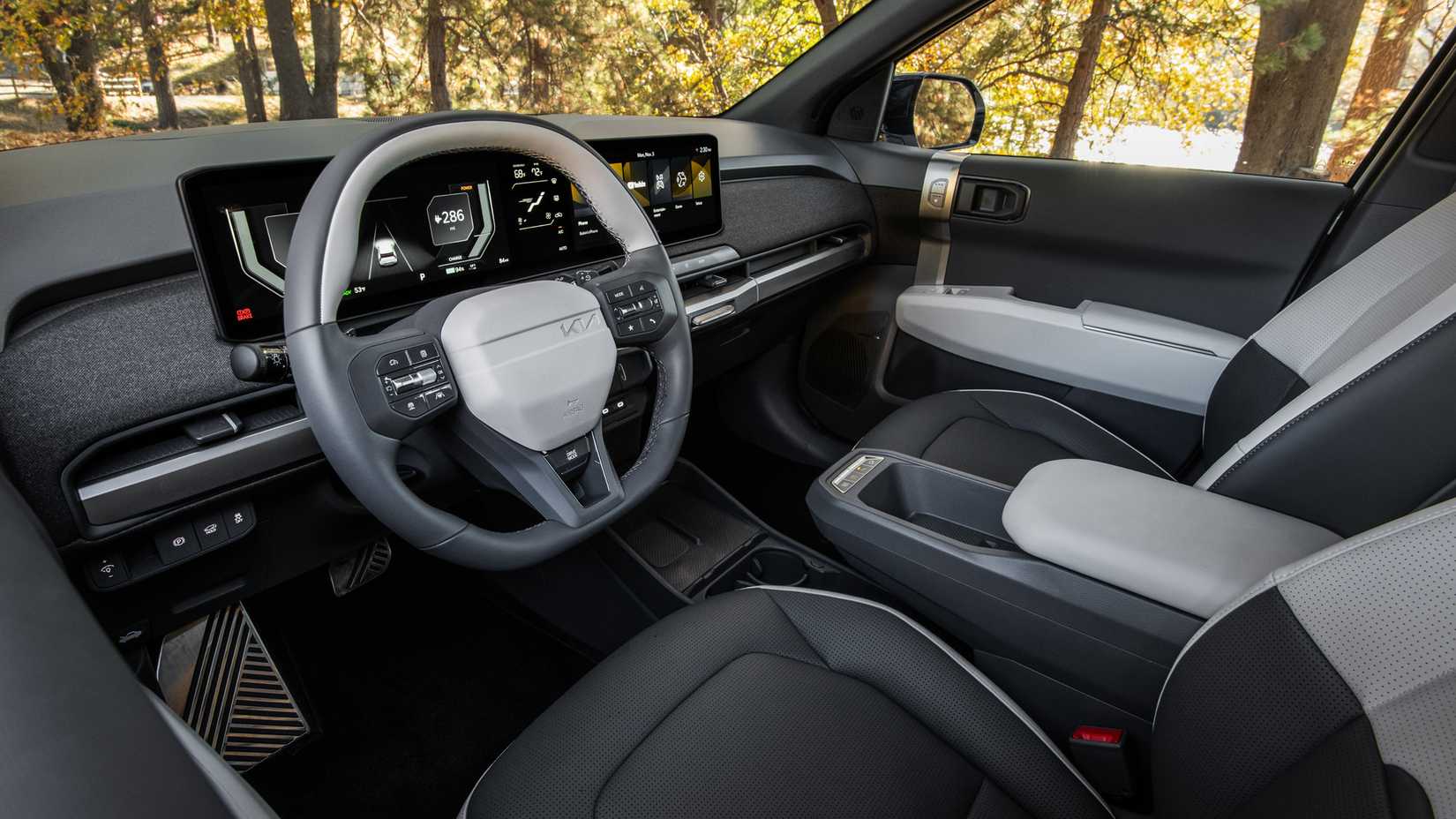 An interior shot of the 2027 Kia EV3's front cabin