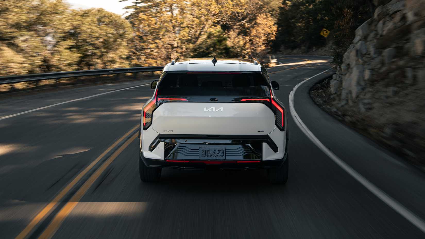 An action shot of the 2027 Kia EV3 on a mountain road