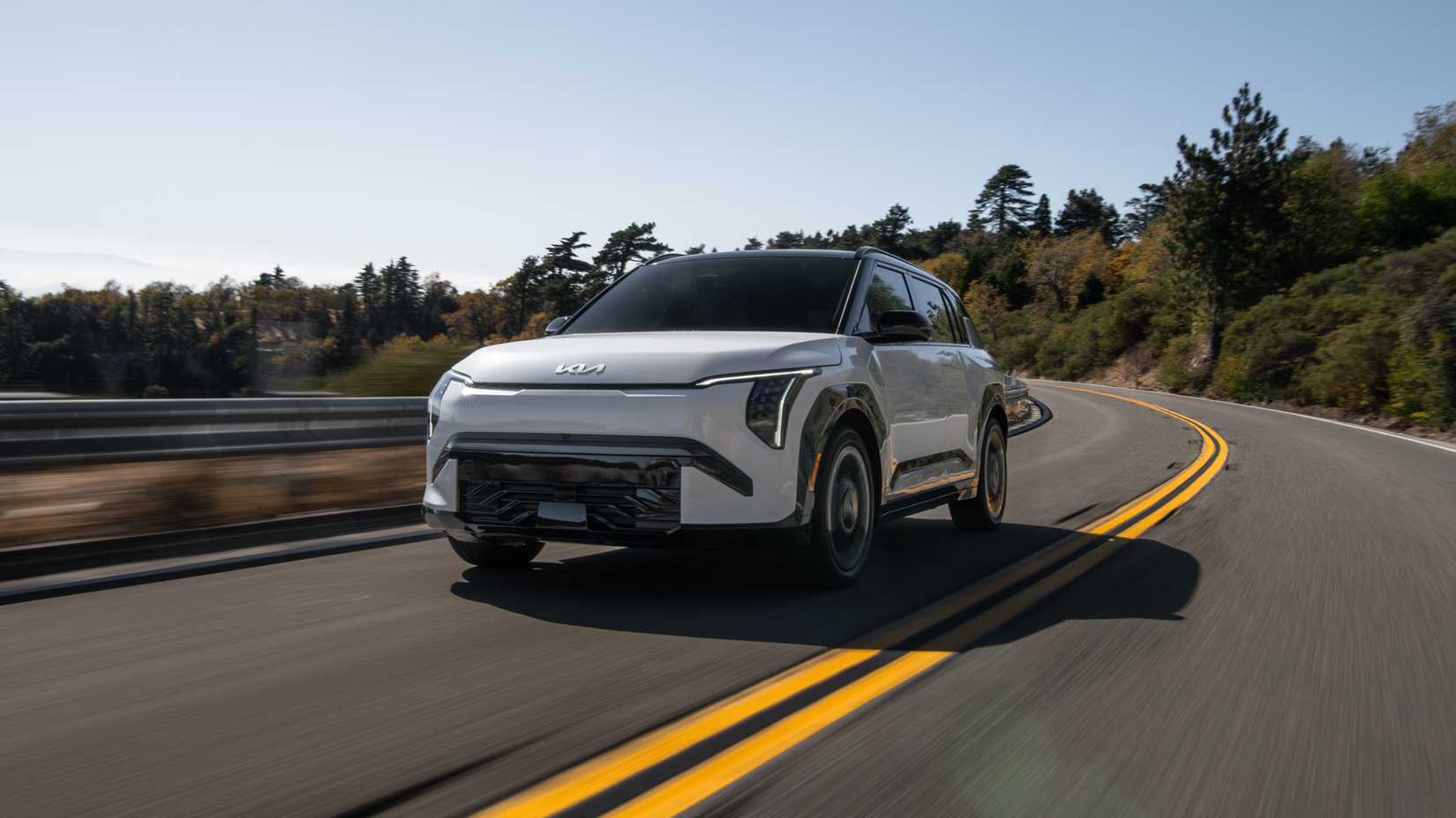 An action shot of the 2027 Kia EV3 on a mountain road