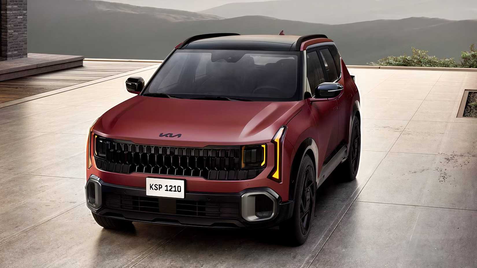 Foto frontal de um Kia Seltos 2027 vermelho estacionado na garagem