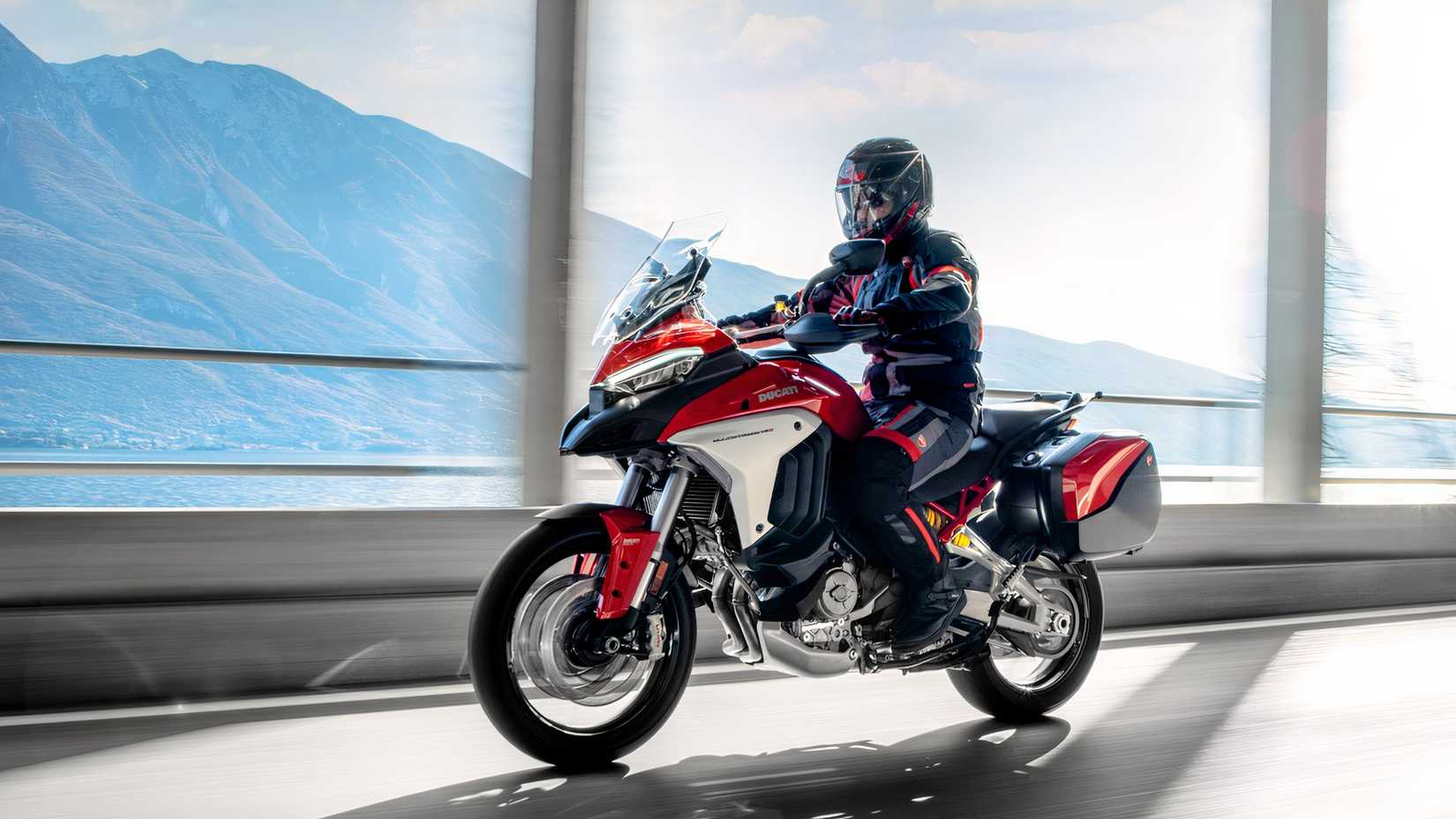 Rider on a red Ducati Multistrada V4 Rally riding on the highway