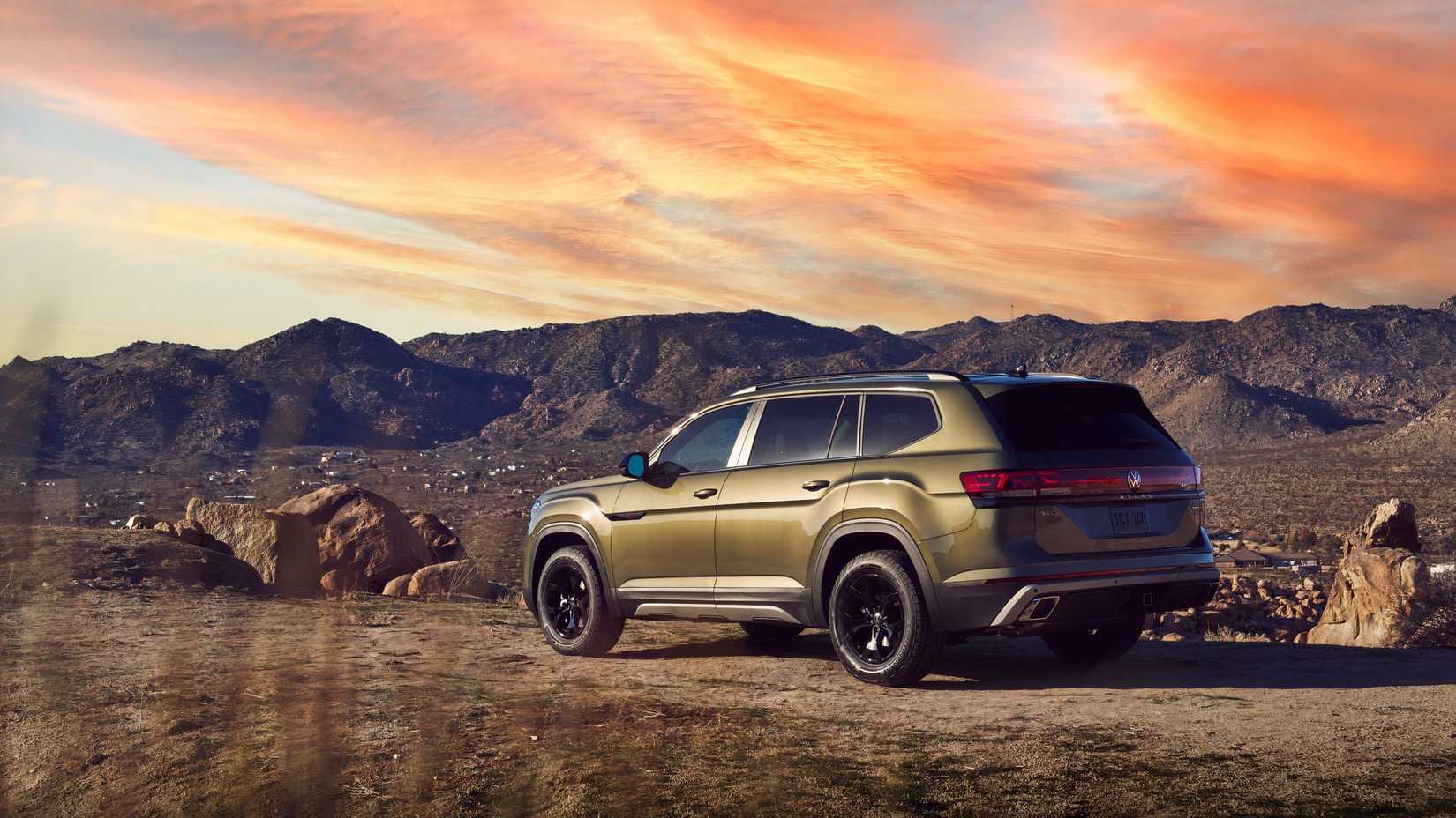 Green 2026 Volkswagen Atlas parked by the mountains