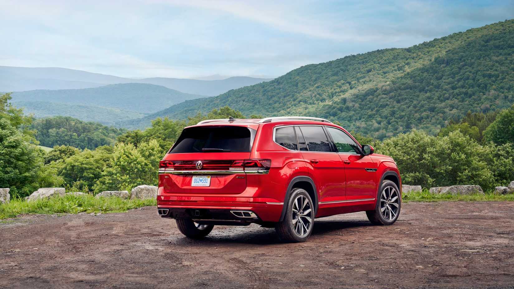 Red 2026 Volkswagen Atlas rear shot parked off-road